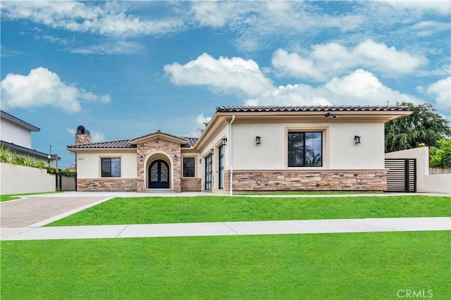 4947 Heleo Ave, Temple City, CA 91780 - mediterranean / spanish home featuring stone siding, stucco siding, a tiled roof, and a chimney