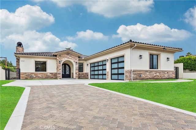 4947 Heleo Ave, Temple City, CA 91780 - mediterranean / spanish-style home featuring stone siding, stucco siding, and decorative driveway