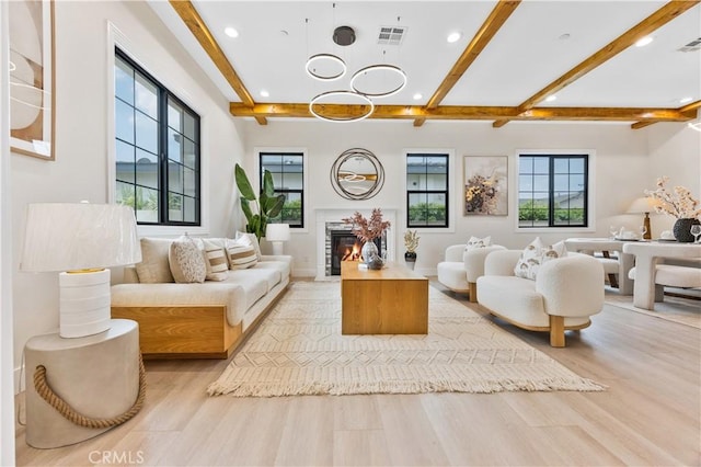 4947 Heleo Ave, Temple City, CA 91780 - living room with beamed ceiling, recessed lighting, light wood finished floors, a glass covered fireplace, and a chandelier