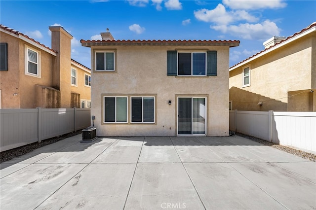 1634 Rigel St, Beaumont, CA 92223 - rear view of house with stucco siding, a patio, and a fenced backyard