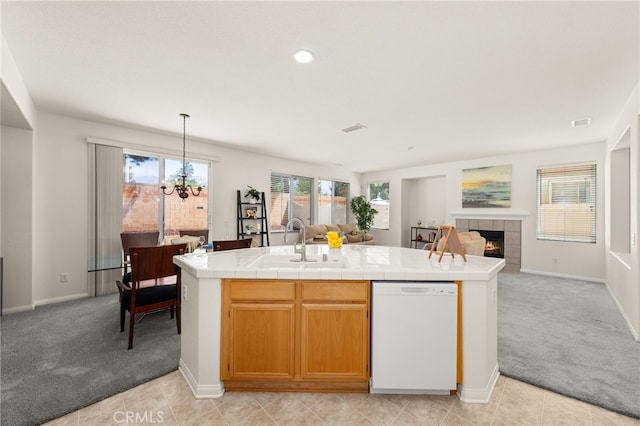 1634 Rigel St, Beaumont, CA 92223 - kitchen featuring dishwasher, light colored carpet, a sink, and tile counters