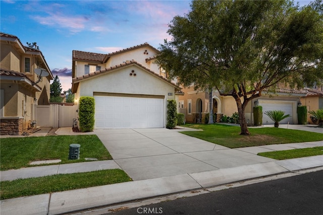 1634 Rigel St, Beaumont, CA 92223 - mediterranean / spanish house featuring concrete driveway, an attached garage, stucco siding, and a tile roof