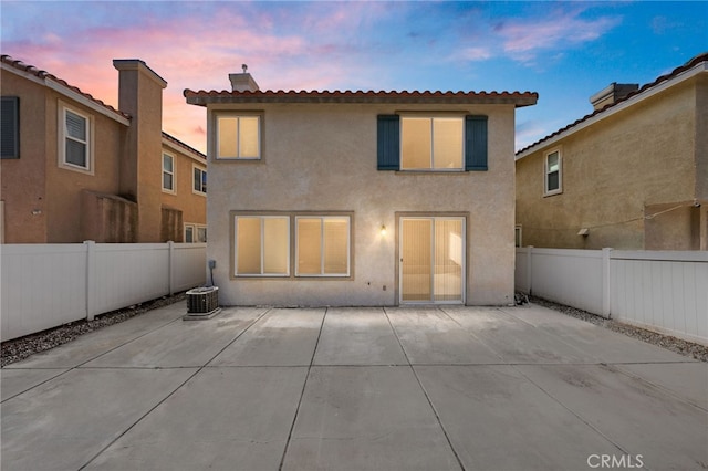 1634 Rigel St, Beaumont, CA 92223 - rear view of house with stucco siding, a patio area, and a fenced backyard