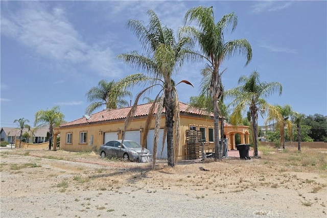 22331 Walnut St, Wildomar, CA 92595 - view of property exterior with a garage, a tile roof, and stucco siding