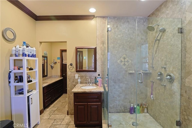 22331 Walnut St, Wildomar, CA 92595 - full bathroom featuring ornamental molding, vanity, a shower stall, stone tile flooring, and recessed lighting