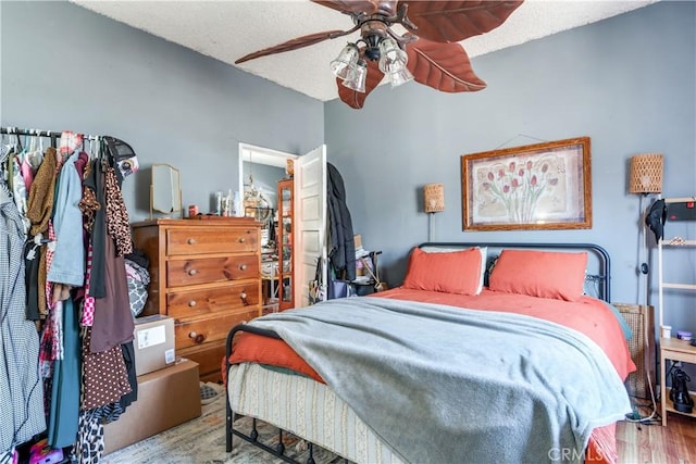 2202 Gates St, Lincoln Heights, CA 90031 - bedroom with wood finished floors, a ceiling fan, and a textured ceiling