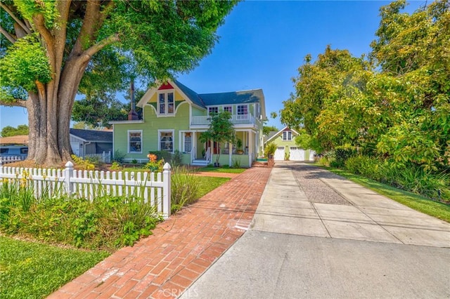 8213 Ocean View Ave, Whittier, CA 90602 - victorian home featuring a balcony, a garage, and concrete driveway