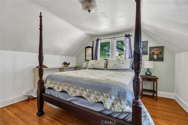 8213 Ocean View Ave, Whittier, CA 90602 - bedroom featuring baseboards, wood finished floors, and vaulted ceiling
