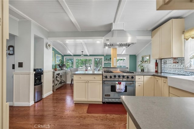 8213 Ocean View Ave, Whittier, CA 90602 - kitchen with premium range, cream cabinetry, a peninsula, wood finished floors, and wall chimney exhaust hood