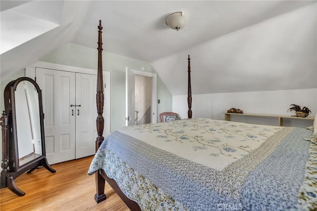 8213 Ocean View Ave, Whittier, CA 90602 - bedroom with light wood-style flooring, lofted ceiling, and a closet
