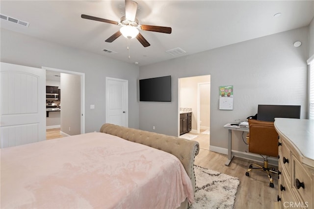 748 Expedition Way W, Madera, CA 93636 - bedroom featuring light wood-style floors, an office area, ensuite bathroom, baseboards, and ceiling fan