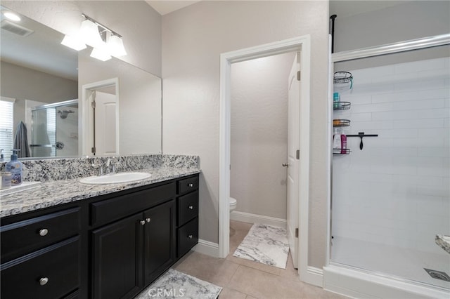 748 Expedition Way W, Madera, CA 93636 - full bathroom with a stall shower, vanity, toilet, and tile patterned flooring