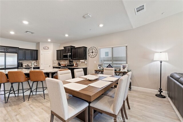 748 Expedition Way W, Madera, CA 93636 - dining area featuring light wood finished floors, baseboards, and recessed lighting