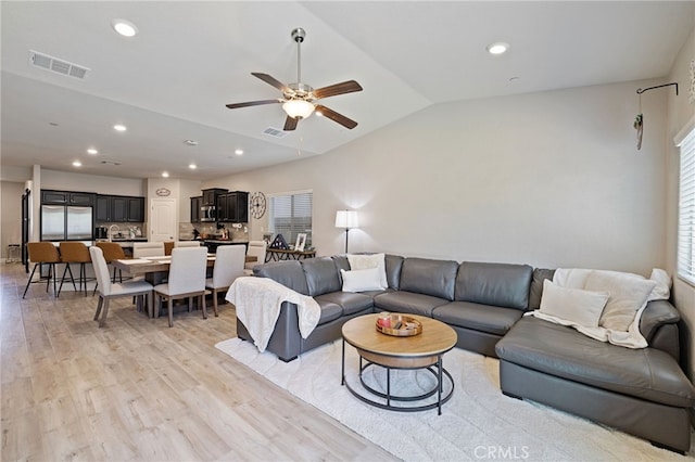 748 Expedition Way W, Madera, CA 93636 - living room featuring light wood-type flooring, lofted ceiling, ceiling fan, and recessed lighting
