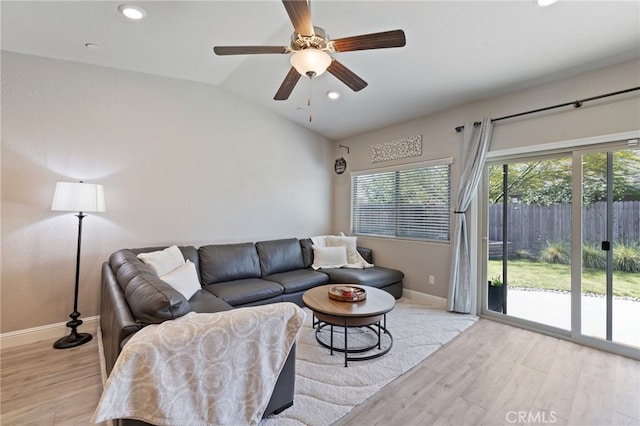 748 Expedition Way W, Madera, CA 93636 - living area featuring baseboards, light wood-type flooring, plenty of natural light, vaulted ceiling, and recessed lighting