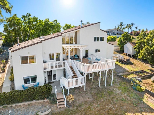 3016 Alta Vista Dr, Fallbrook, CA 92028 - back of house with a garden, stucco siding, a pergola, and stairway