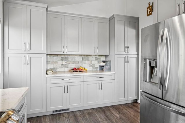 3016 Alta Vista Dr, Fallbrook, CA 92028 - kitchen with stainless steel fridge, dark wood-type flooring, tasteful backsplash, light stone counters, and gray cabinetry