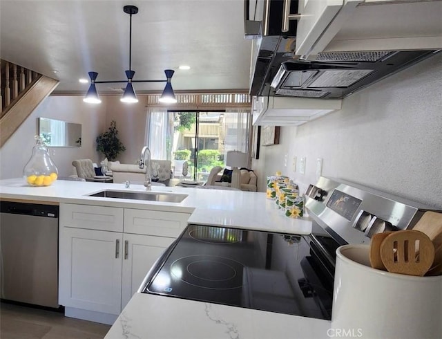 77 Lakepines, Irvine, CA 92620 - kitchen featuring stainless steel dishwasher, a sink, white cabinets, light countertops, and recessed lighting