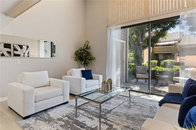 77 Lakepines, Irvine, CA 92620 - living area with wood finished floors, a towering ceiling, and plenty of natural light