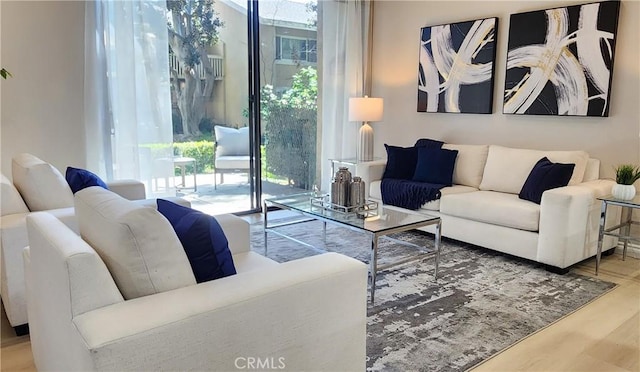 77 Lakepines, Irvine, CA 92620 - living room with plenty of natural light and wood finished floors