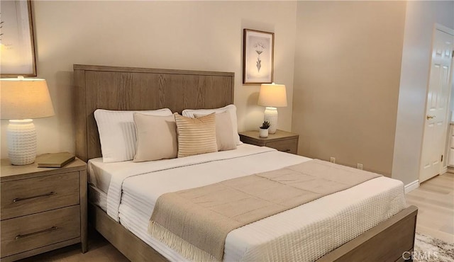77 Lakepines, Irvine, CA 92620 - bedroom featuring light wood-style floors and baseboards