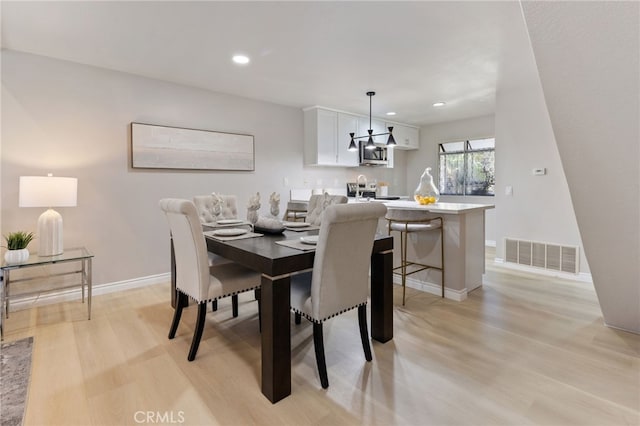 77 Lakepines, Irvine, CA 92620 - dining area with light wood-style flooring, recessed lighting, baseboards, and a chandelier