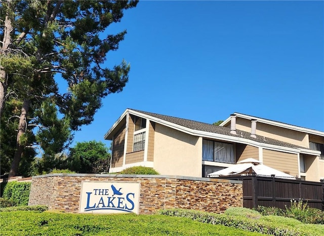 77 Lakepines, Irvine, CA 92620 - view of side of home featuring stucco siding