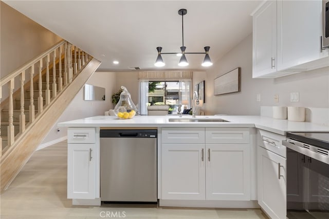77 Lakepines, Irvine, CA 92620 - kitchen featuring appliances with stainless steel finishes, a sink, a peninsula, and white cabinets