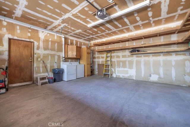 817 E Mountain View Blvd, Big Bear City, CA 92314 - garage with washing machine and clothes dryer and a garage door opener