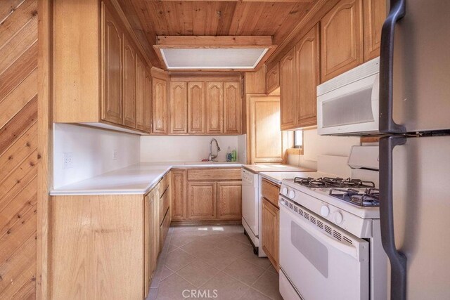817 E Mountain View Blvd, Big Bear City, CA 92314 - kitchen with white appliances, wooden ceiling, light countertops, light tile patterned flooring, and a sink