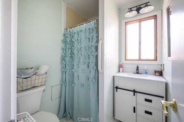817 E Mountain View Blvd, Big Bear City, CA 92314 - bathroom with toilet, vanity, and curtained shower