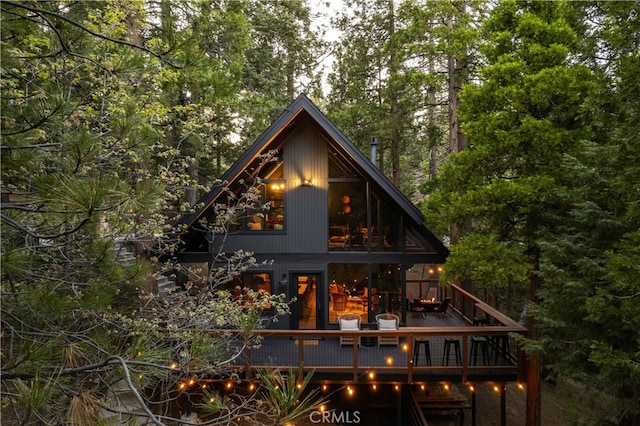 607 Old Toll Rd, Lake Arrowhead, CA 92352 - back of property featuring a deck