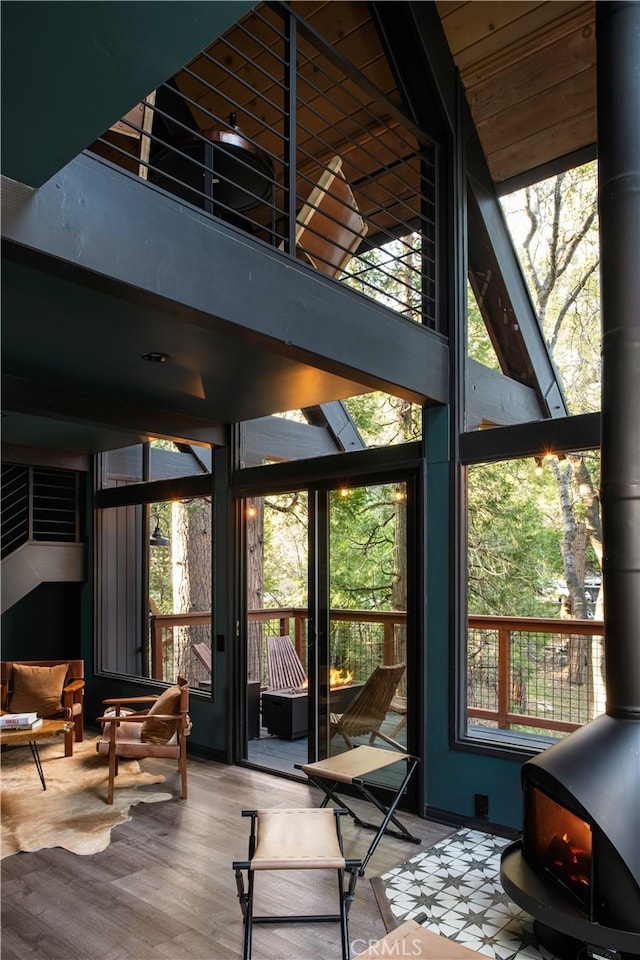 607 Old Toll Rd, Lake Arrowhead, CA 92352 - sunroom / solarium featuring healthy amount of natural light and a wood stove
