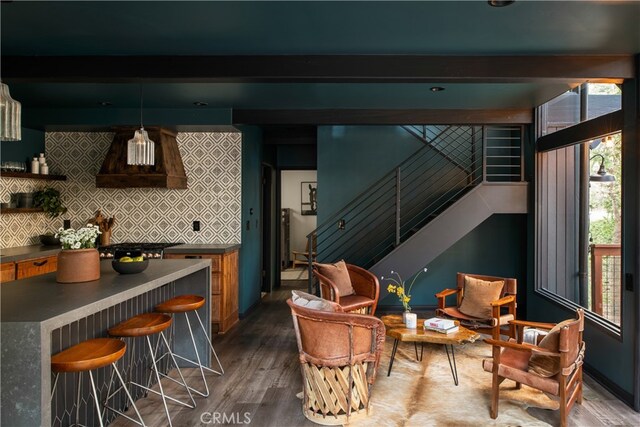 607 Old Toll Rd, Lake Arrowhead, CA 92352 - kitchen with custom exhaust hood, beamed ceiling, decorative backsplash, dark wood-style flooring, and dark countertops