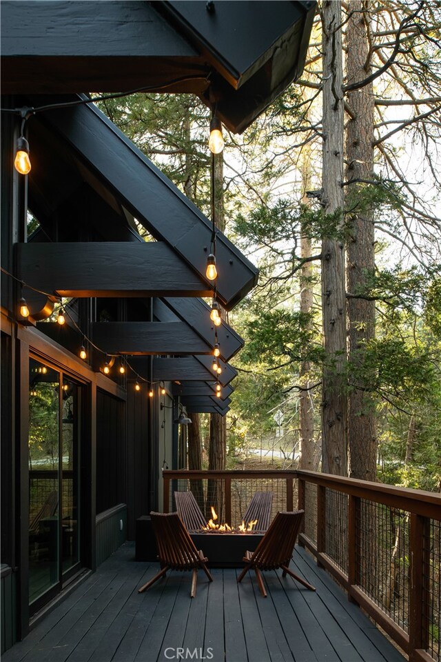 607 Old Toll Rd, Lake Arrowhead, CA 92352 - wooden deck featuring a fire pit