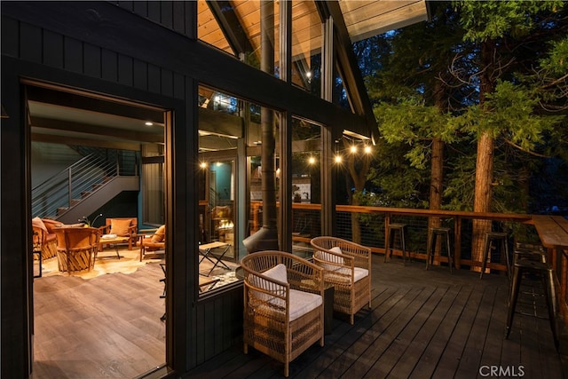 607 Old Toll Rd, Lake Arrowhead, CA 92352 - deck at night featuring outdoor dining space