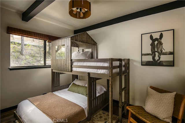 607 Old Toll Rd, Lake Arrowhead, CA 92352 - bedroom featuring beamed ceiling, wood finished floors, and baseboards