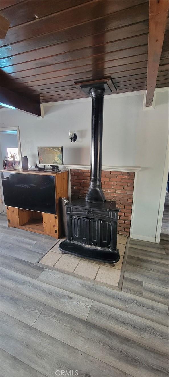 5914 N Rockvale Ave, Azusa, CA 91702 - detailed view of wooden ceiling, wood finished floors, and a wood stove