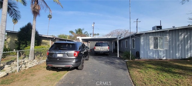 5914 N Rockvale Ave, Azusa, CA 91702 - view of front of property featuring board and batten siding, driveway, and an attached carport