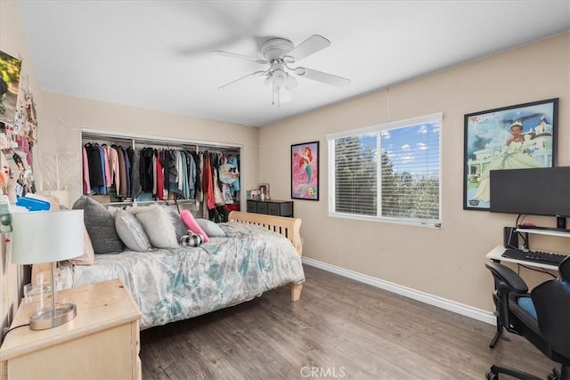 27109 Woodglen Ln, Moreno Valley, CA 92555 - bedroom featuring baseboards, a closet, wood finished floors, an office area, and ceiling fan