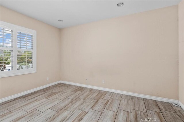 27109 Woodglen Ln, Moreno Valley, CA 92555 - spare room featuring baseboards, wood finish floors, and recessed lighting