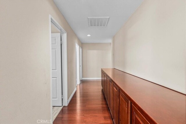 27109 Woodglen Ln, Moreno Valley, CA 92555 - hall with dark wood-style floors, baseboards, and recessed lighting