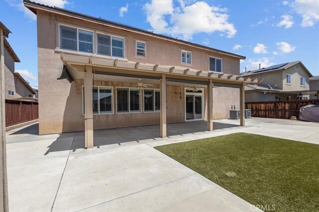 27109 Woodglen Ln, Moreno Valley, CA 92555 - back of property with stucco siding, a ceiling fan, and a patio area