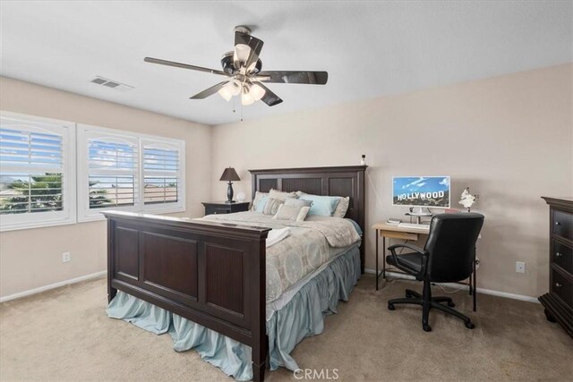 27109 Woodglen Ln, Moreno Valley, CA 92555 - bedroom with light colored carpet, baseboards, a ceiling fan, and an office area