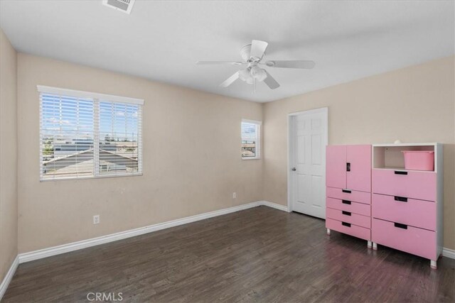 27109 Woodglen Ln, Moreno Valley, CA 92555 - unfurnished bedroom with baseboards, wood finished floors, and ceiling fan