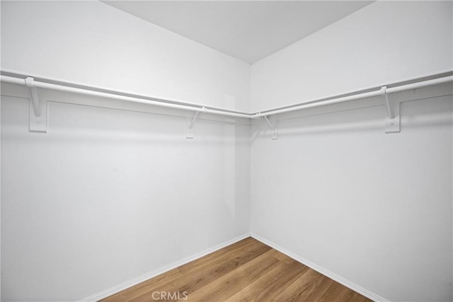 1349 Gordon Ct, Beaumont, CA 92223 - walk in closet featuring wood finished floors