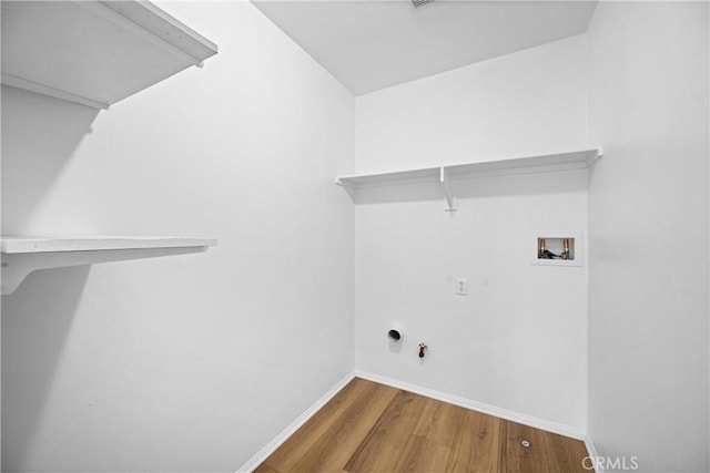 1349 Gordon Ct, Beaumont, CA 92223 - washroom with hookup for a washing machine, hookup for a gas dryer, wood finished floors, and baseboards