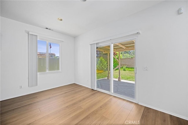 1349 Gordon Ct, Beaumont, CA 92223 - empty room with light wood finished floors, healthy amount of natural light, and baseboards