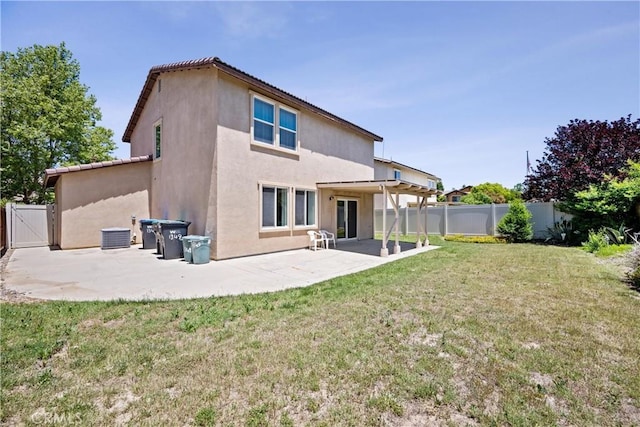 1349 Gordon Ct, Beaumont, CA 92223 - rear view of house featuring a patio area, stucco siding, and a gate