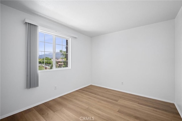 1349 Gordon Ct, Beaumont, CA 92223 - unfurnished room featuring wood finished floors and baseboards